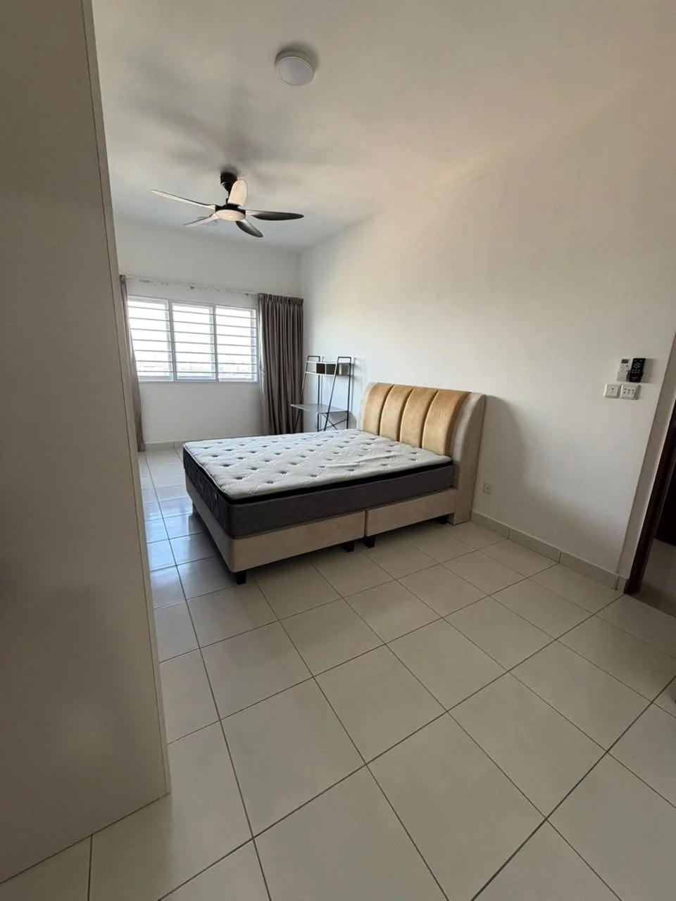 Bedroom features: queen-size bed, upholstered headboard, ceiling fan, floor-to-ceiling windows, curtains, white painted walls, tile flooring, nightstand, built-in wardrobe; style: modern.